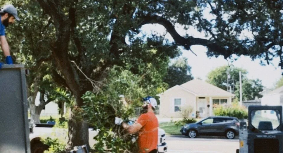 A photo of volunteers working outside of a Habitat home.